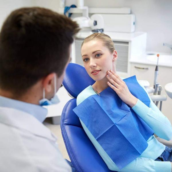 woman discussing anxiety with dentist