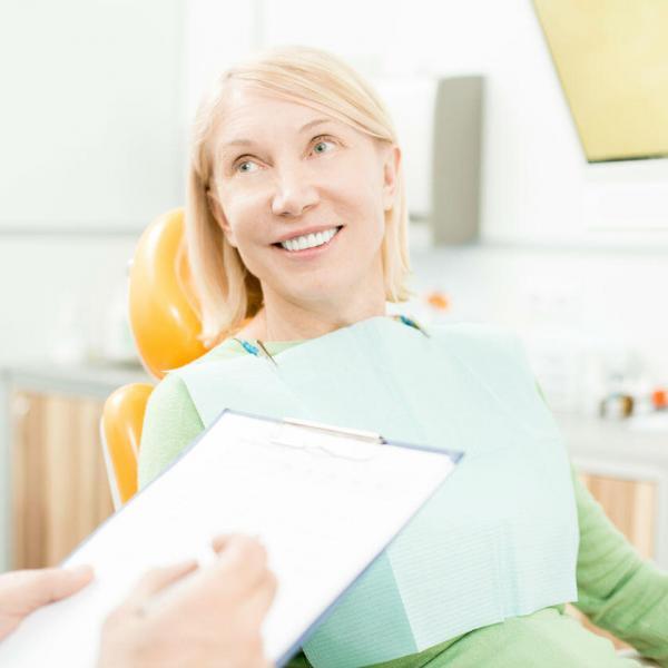 discussing medical history with dentist