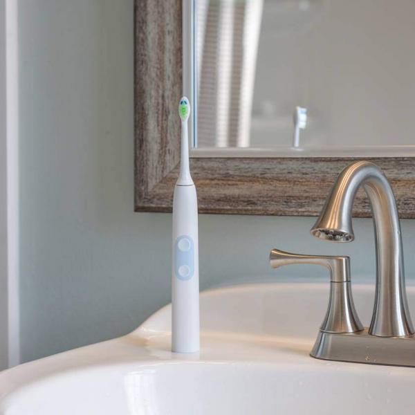 electric toothbrush on sink