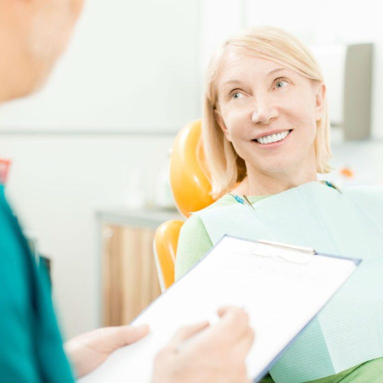 discussing medical history with dentist