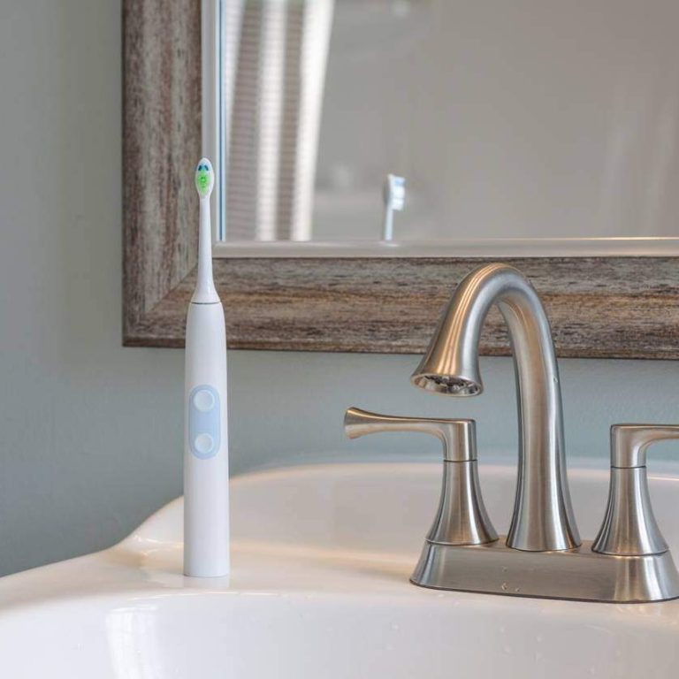 electric toothbrush on sink